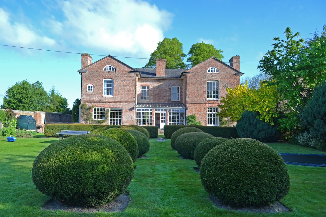 Llandrinio Hall in North Wales. 

The house is said to replace a building extant before 1589 in the kitchen garden to the SW, occupied at one time by John y cap goch. The present house was built for Walter Clopton, nephew of the Bishop of St Asaph and Sheriff of Montgomeryshire, 1682, and occupied by subsequent sheriffs 1775 (Clopton Prhys), in 1855 (Edmund Peel, cousin of Sir Robert Peel), and 1907.